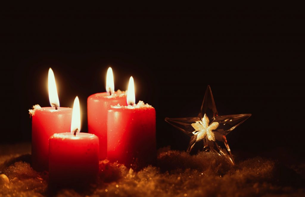 Advent Candles shining in the dark